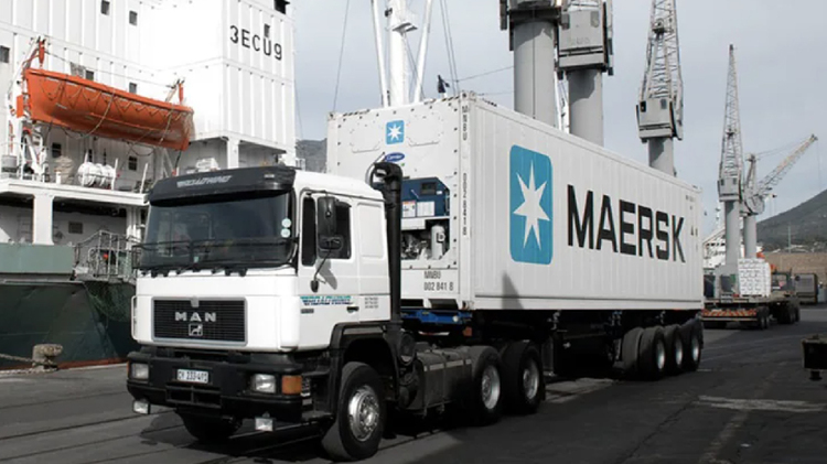 Refrigerated Maersk Truck Transporting Temperature-Sensitive Goods at a Shipping Port