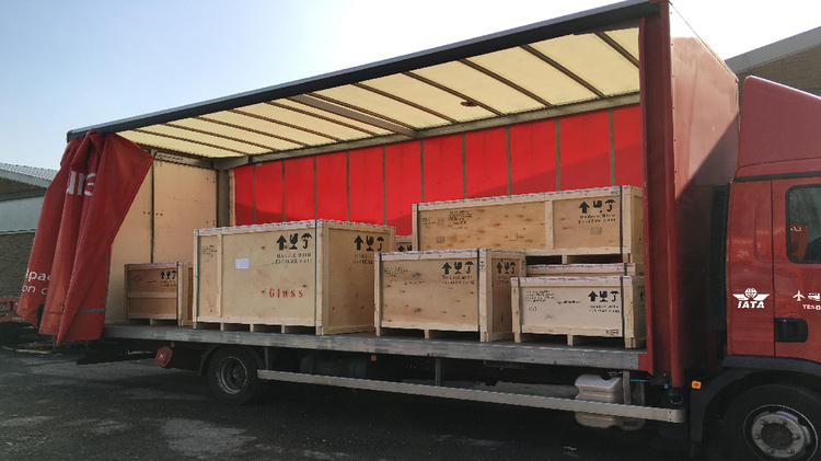 Cargo Crates Loaded onto a Truck for Middle East Road Freight Services